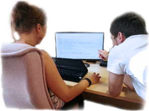 Two people looking at screen.