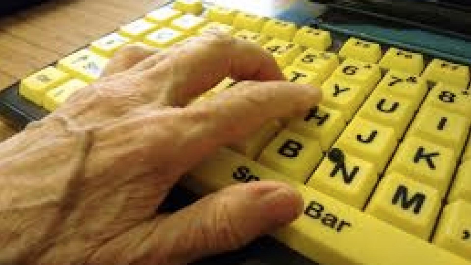 Hands on a high visibility keyboard